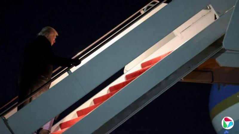 U.S. President Donald Trump boards Air Force One for travel to the World Economic Forum in Davos, Switzerland, from Joint Base Andrews, Maryland, U.S., January 20, 2026.